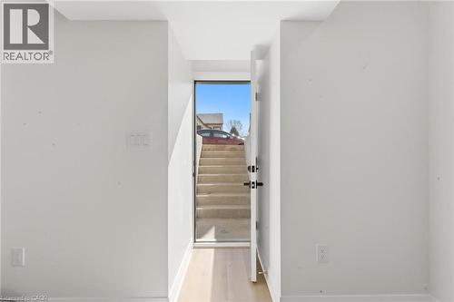 Staircase with wood finished floors and baseboards - 187 Oak Avenue Unit# Lower, Hamilton, ON - Indoor Photo Showing Other Room