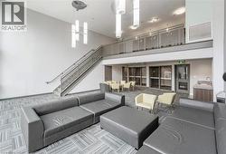Community lobby featuring stairway and a sink - 