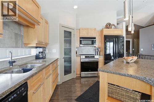 102 802 Heritage Crescent, Saskatoon, SK - Indoor Photo Showing Kitchen With Double Sink