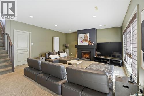 102 802 Heritage Crescent, Saskatoon, SK - Indoor Photo Showing Living Room With Fireplace