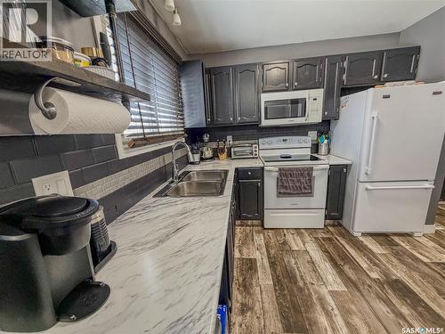 210 Wells Avenue E, Langenburg, SK - Indoor Photo Showing Kitchen With Double Sink