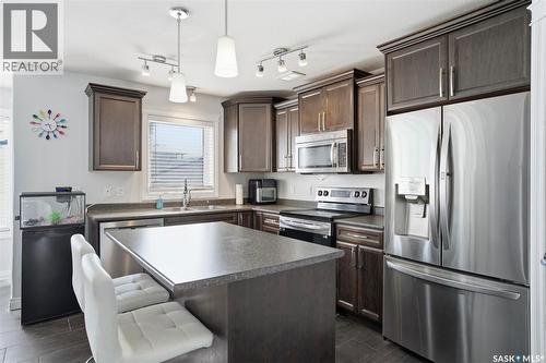 215 Wyant Lane, Saskatoon, SK - Indoor Photo Showing Kitchen With Double Sink