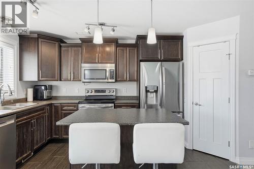 215 Wyant Lane, Saskatoon, SK - Indoor Photo Showing Kitchen With Double Sink