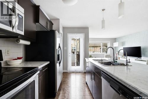 12 5301 Beacon Drive, Regina, SK - Indoor Photo Showing Kitchen With Double Sink