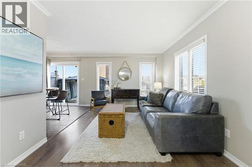 Living area with dark wood-style floors and crown molding - 208 Templewood Drive, Kitchener, ON - Indoor Photo Showing Living Room