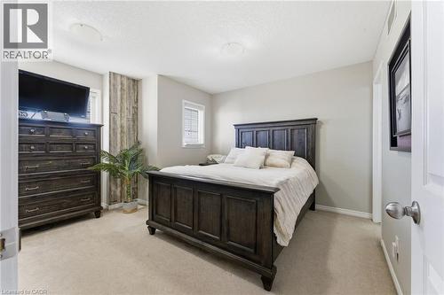 Bedroom featuring light carpet and a textured ceiling - 208 Templewood Drive, Kitchener, ON - Indoor Photo Showing Bedroom