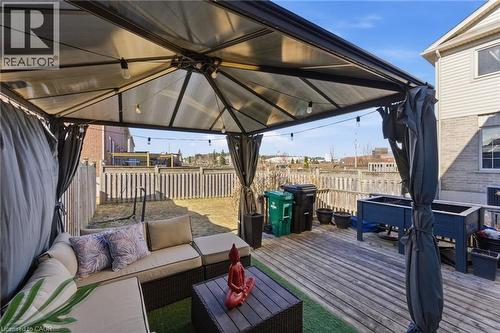 Wooden terrace featuring a gazebo, outdoor furniture, and a fenced backyard - 208 Templewood Drive, Kitchener, ON - Outdoor With Deck Patio Veranda With Exterior