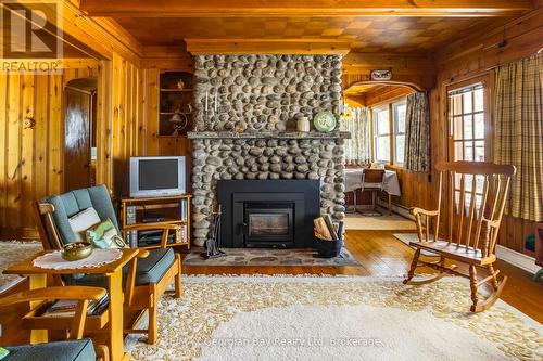 750 Tiny Beaches Road S, Tiny, ON - Indoor Photo Showing Living Room With Fireplace