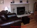 319 Main Road, Come By Chance, NL  - Indoor Photo Showing Living Room With Fireplace 