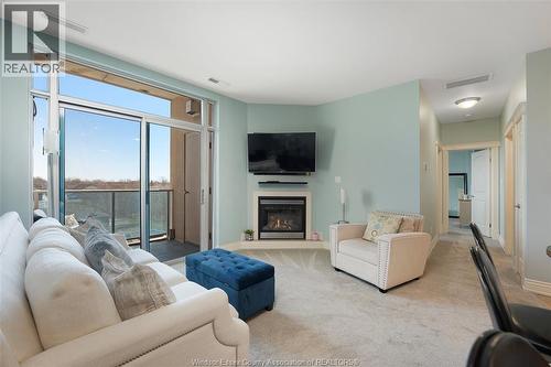 1225 Riverside Unit# 409, Windsor, ON - Indoor Photo Showing Living Room With Fireplace