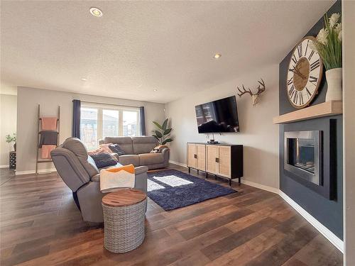 36 Southview Drive, Brandon, MB - Indoor Photo Showing Living Room With Fireplace