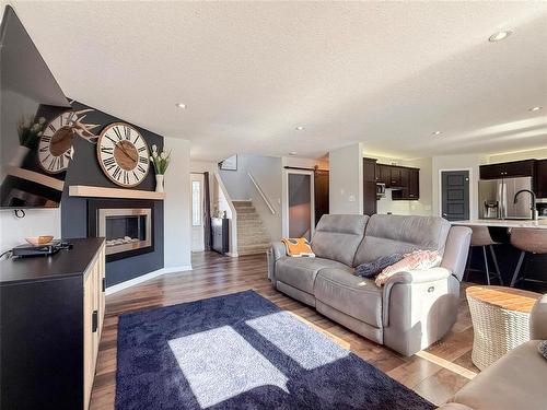 36 Southview Drive, Brandon, MB - Indoor Photo Showing Living Room With Fireplace