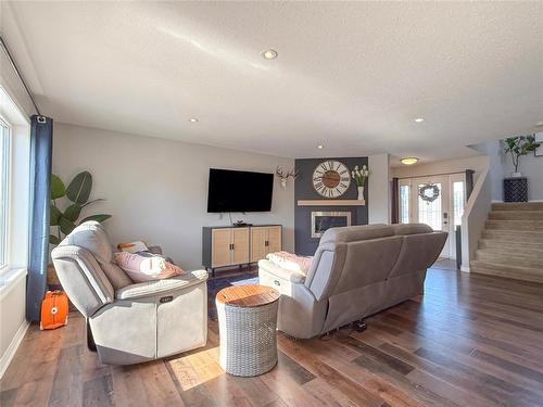 36 Southview Drive, Brandon, MB - Indoor Photo Showing Living Room With Fireplace