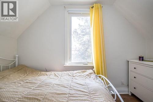Second bedroom featuring a closet and a lovely view overlooking the backyard. - 500 Ferguson Avenue N, Hamilton, ON - Indoor Photo Showing Bedroom