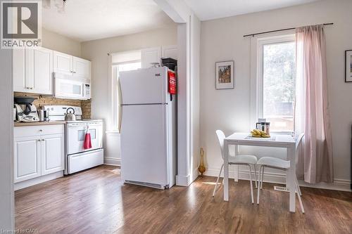 Bright and charming kitchen seamlessly flowing into the dining space, perfect for entertaining. - 500 Ferguson Avenue N, Hamilton, ON - Indoor Photo Showing Kitchen