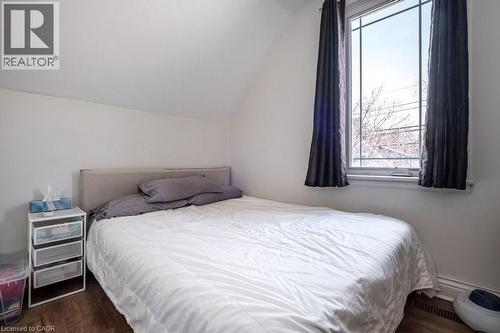 Charming front view of the home with a newer window and closet. - 500 Ferguson Avenue N, Hamilton, ON - Indoor Photo Showing Bedroom