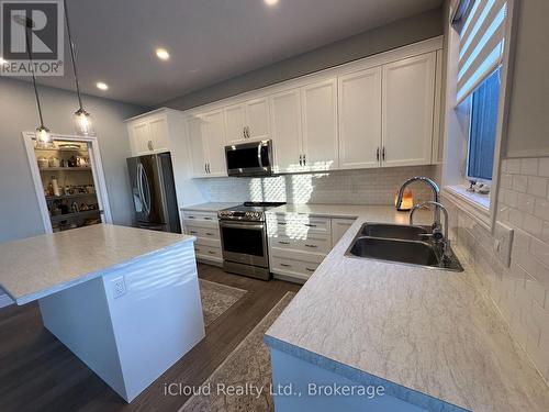 106 Queensgate Crescent, Woolwich, ON - Indoor Photo Showing Kitchen With Double Sink