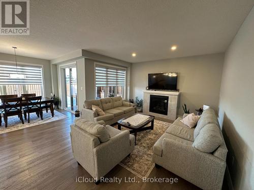 106 Queensgate Crescent, Woolwich, ON - Indoor Photo Showing Living Room With Fireplace