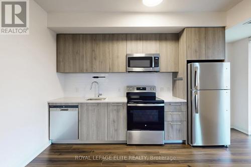 313 - 101 Cathedral High Street, Markham, ON - Indoor Photo Showing Kitchen With Stainless Steel Kitchen