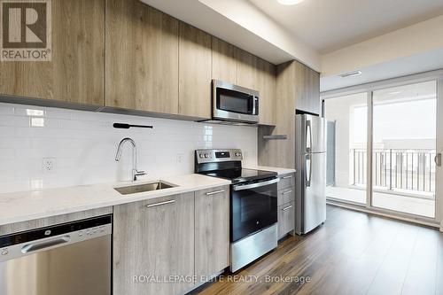 313 - 101 Cathedral High Street, Markham, ON - Indoor Photo Showing Kitchen With Stainless Steel Kitchen With Upgraded Kitchen