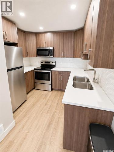 3326 Green Turtle Road, Regina, SK - Indoor Photo Showing Kitchen With Double Sink