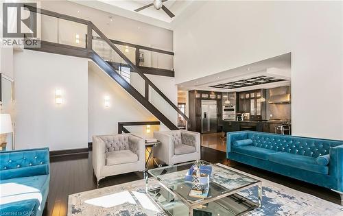 Living area with wood-type flooring, ceiling fan, and a high ceiling - 24 Jacob Gingrich Drive, Kitchener, ON - Indoor