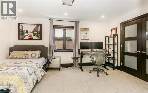 Bedroom featuring french doors, light colored carpet, a desk, and recessed lighting - 24 Jacob Gingrich Drive, Kitchener, ON - Indoor Photo Showing Bedroom