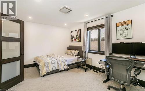 Bedroom featuring light carpet, a desk, and recessed lighting - 24 Jacob Gingrich Drive, Kitchener, ON - Indoor