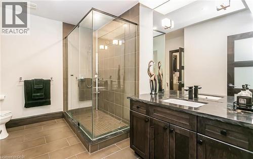 Bathroom featuring vanity, a shower stall, and dark tile patterned flooring - 24 Jacob Gingrich Drive, Kitchener, ON - Indoor Photo Showing Bathroom