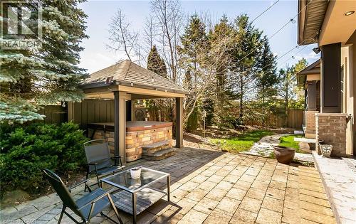 Fenced backyard featuring a patio area, a hot tub, and a gazebo - 24 Jacob Gingrich Drive, Kitchener, ON - Outdoor With Deck Patio Veranda