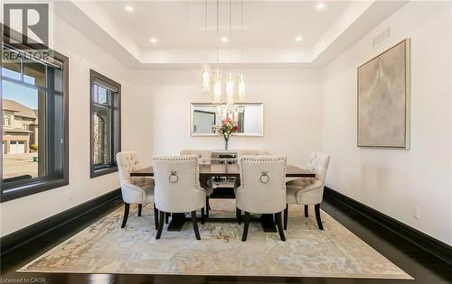 Dining area featuring a tray ceiling and recessed lighting - 24 Jacob Gingrich Drive, Kitchener, ON - Indoor Photo Showing Dining Room