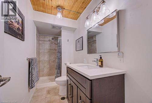 Bathroom featuring a stall shower, vanity, wood ceiling, and light tile patterned flooring - 85 Spruce Street Unit# 103, Cambridge, ON - Indoor Photo Showing Bathroom