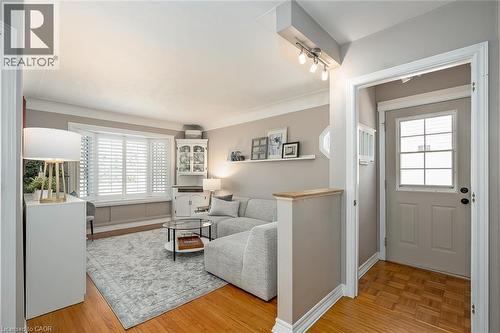 Living room featuring light wood-style flooring and baseboards - 220 Townsend Avenue, Burlington, ON - Indoor