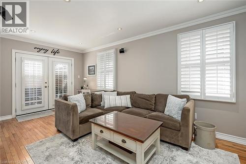 Living area featuring light wood finished floors, french doors, ornamental molding, and recessed lighting - 220 Townsend Avenue, Burlington, ON - Indoor Photo Showing Living Room