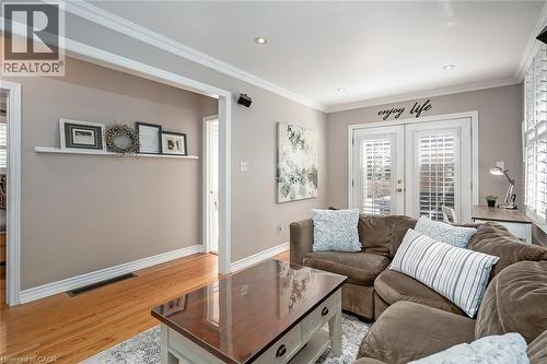 Living room featuring crown molding, light wood finished floors, french doors, and recessed lighting - 220 Townsend Avenue, Burlington, ON - Indoor Photo Showing Living Room