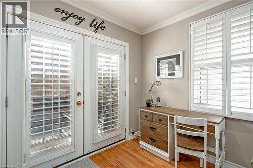 Doorway to outside with french doors, crown molding, wood finished floors, and a desk - 220 Townsend Avenue, Burlington, ON - Indoor Photo Showing Other Room