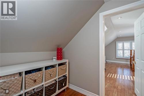 Additional living space featuring dark wood-style flooring, vaulted ceiling, and recessed lighting - 220 Townsend Avenue, Burlington, ON - Indoor Photo Showing Other Room