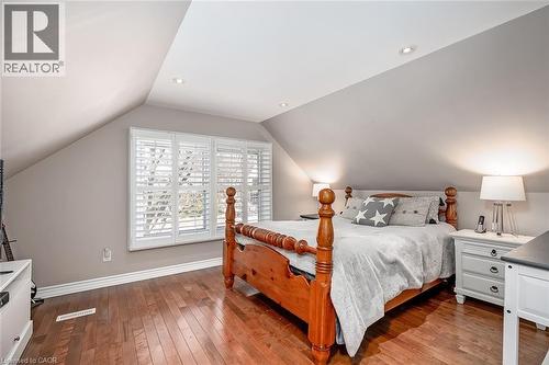 Bedroom featuring dark wood-style floors and recessed lighting - 220 Townsend Avenue, Burlington, ON - Indoor Photo Showing Bedroom