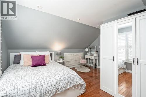 Bedroom with lofted ceiling, dark wood-style floors, and recessed lighting - 220 Townsend Avenue, Burlington, ON - Indoor Photo Showing Bedroom
