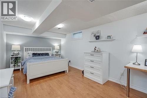 Bedroom featuring light wood-style flooring and a textured ceiling - 220 Townsend Avenue, Burlington, ON - Indoor Photo Showing Bedroom