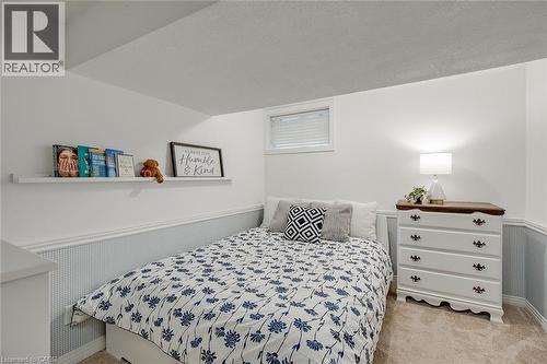 Bedroom with a wainscoted wall, a textured ceiling, and light colored carpet - 220 Townsend Avenue, Burlington, ON - Indoor Photo Showing Bedroom