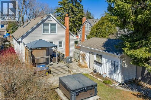 Back of property with a gazebo, a hot tub, a deck, an outdoor structure, and roof with shingles - 220 Townsend Avenue, Burlington, ON - Outdoor