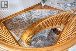 Stairway featuring brick patterned floors - 