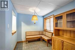 Unfurnished room with a paneled ceiling and light flooring - 