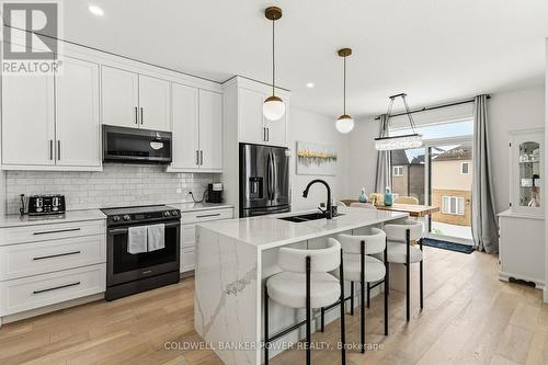 2884 Doyle Drive, London South (South U), ON - Indoor Photo Showing Kitchen With Double Sink With Upgraded Kitchen