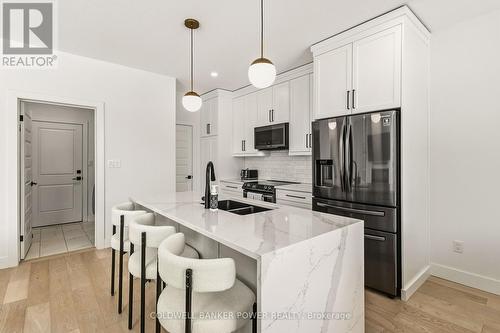 2884 Doyle Drive, London South (South U), ON - Indoor Photo Showing Kitchen With Double Sink With Upgraded Kitchen