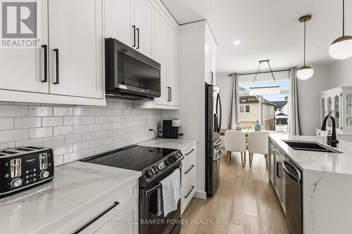 2884 Doyle Drive, London South (South U), ON - Indoor Photo Showing Kitchen With Double Sink With Upgraded Kitchen