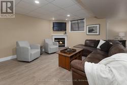 Family Room with Gas Fireplace in Basement - 