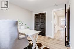 Office featuring light wood-style floors - 