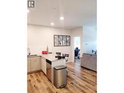 Open concept living room and kitchen with eating bar - 